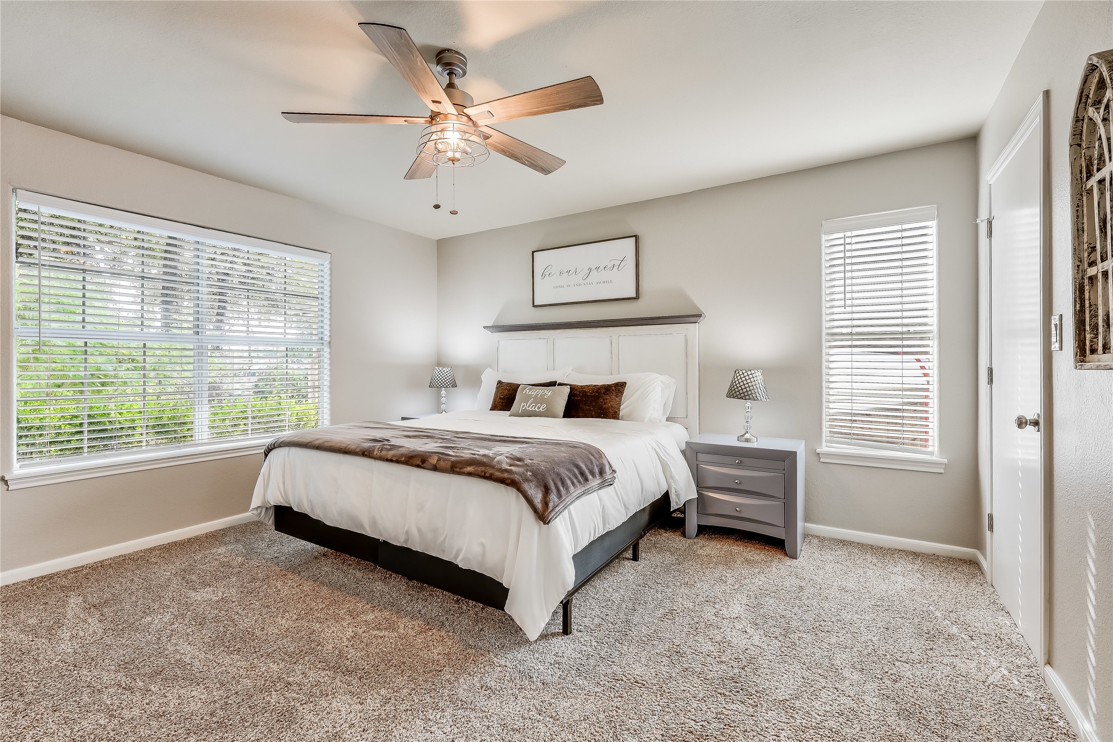 426 Summit Ridge Drive North Point Venture, TX 78645 - Photo 16 of 28 Bedroom with light colored carpet and ceiling fan