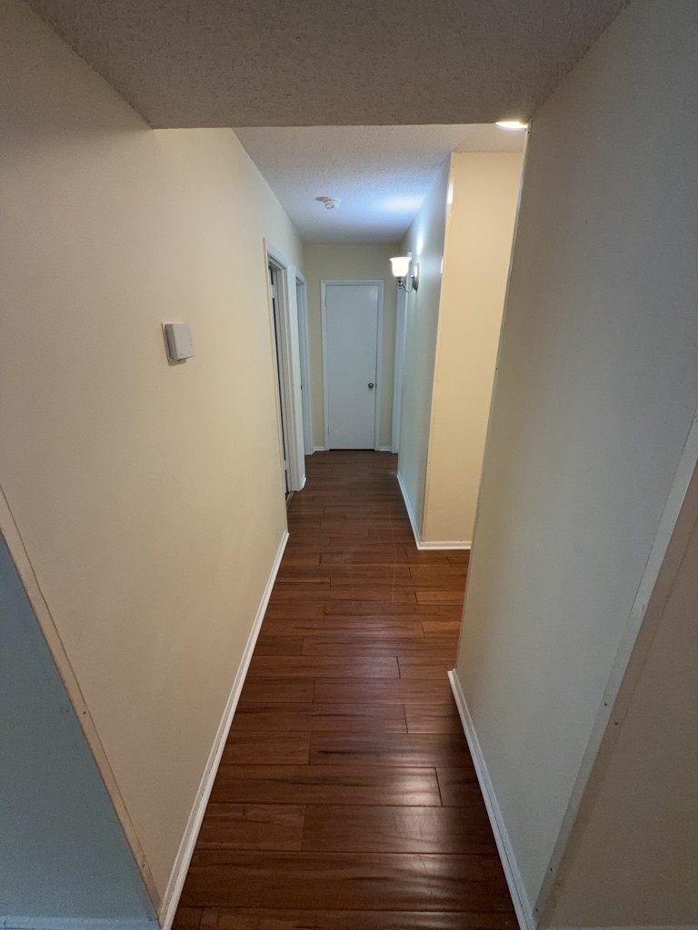 441 Harding Place, Unit A14 Nashville, TN 37211 - Photo 5 of 8 a view of a hallway with wooden floor