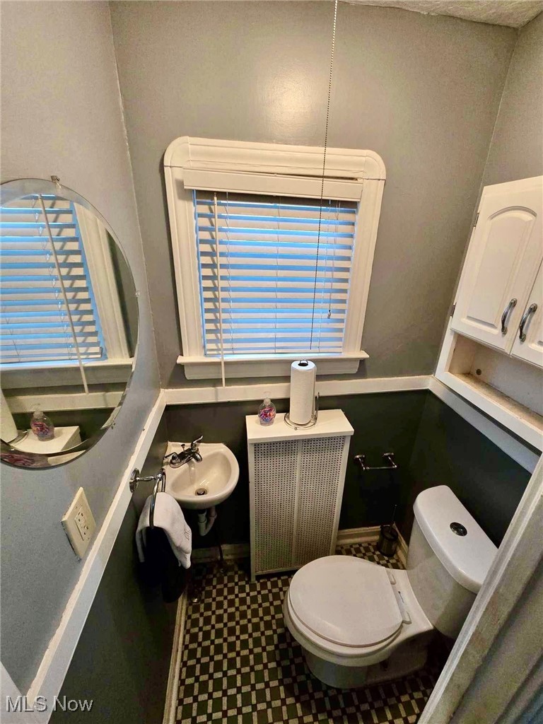3505 Silsby Road Cleveland, OH 44118 - Photo 11 of 34 Bathroom with radiator heating unit, toilet, and sink