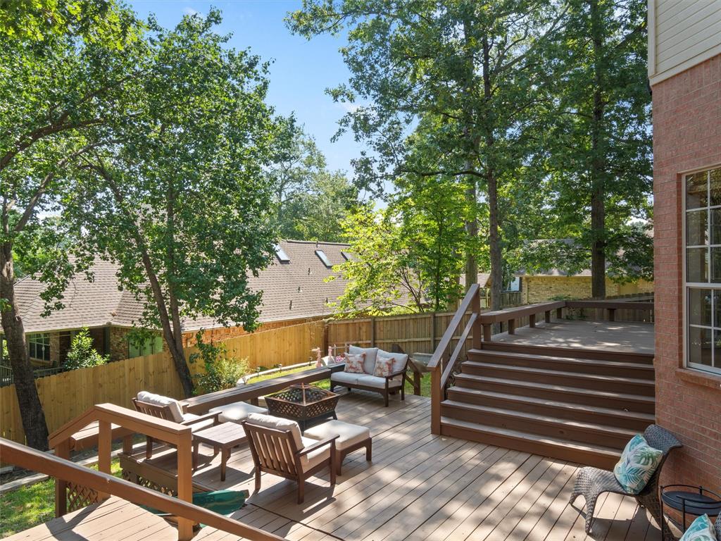 1103 Marigold Lane Longview, TX 75604 - Photo 31 of 34 a view of a patio with chairs and iron fence