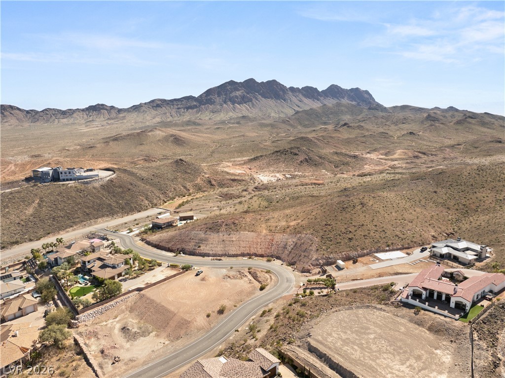 Perched on a mountain's edge, this property offers unparalleled views of the expansive desert landscape.