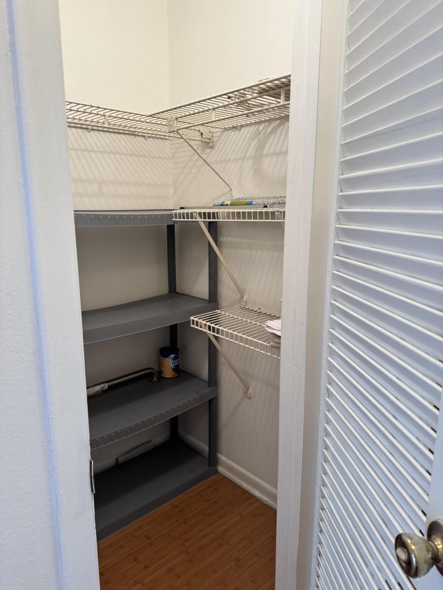6 Keswick A, Unit 6 Deerfield Beach, FL 33442 - Photo 5 of 17 a utility room with dryer and washer