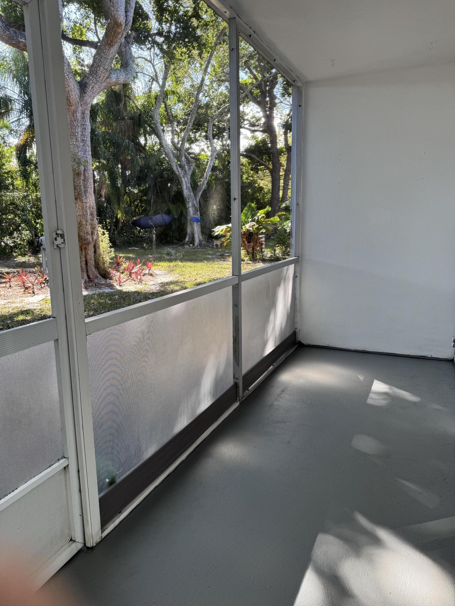 6 Keswick A, Unit 6 Deerfield Beach, FL 33442 - Photo 8 of 17 a view of a garage