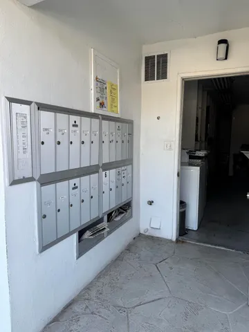 a view of a utility room with stairs