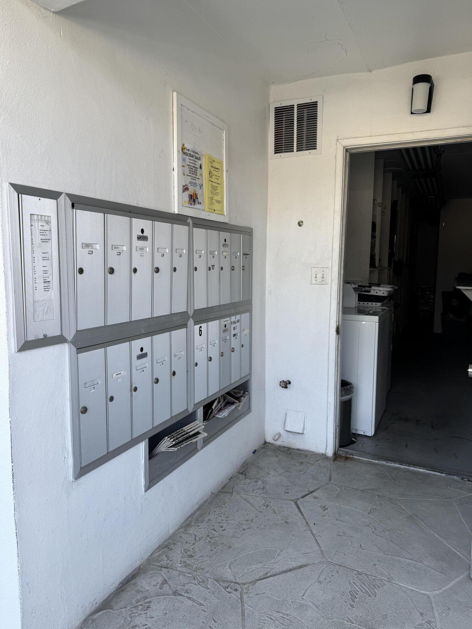 6 Keswick A, Unit 6 Deerfield Beach, FL 33442 - Photo 10 of 17 a view of a utility room with stairs