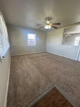 a view of an empty room with a window