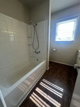 a bathroom with a bathtub and a shower