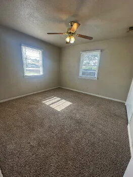 a view of an empty room and window