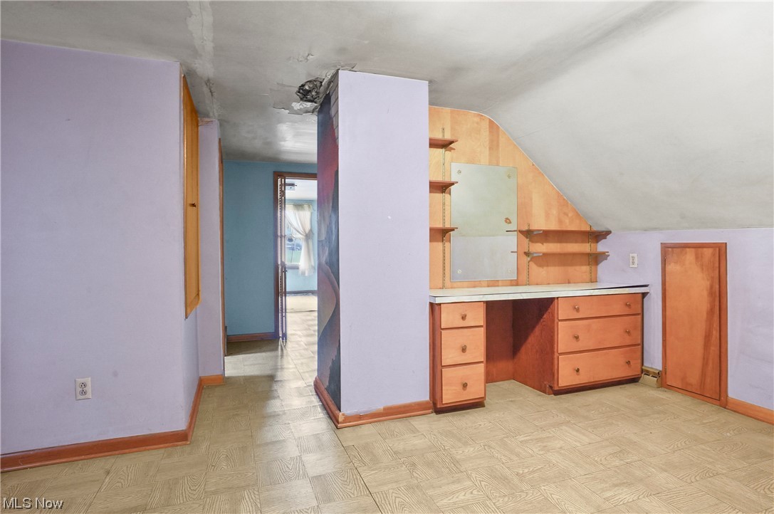 7380 Tallmadge Road Rootstown, OH 44272 - Photo 20 of 23 Unfurnished office featuring built in desk area, could be converted into tandem bedroom area