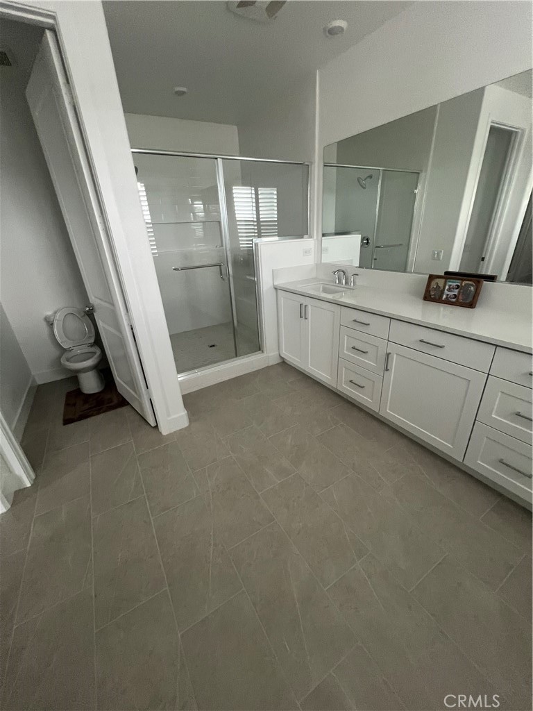 524 Gadwall Irvine, CA 92618 - Photo 22 of 24 a bathroom with a double vanity sink and mirror