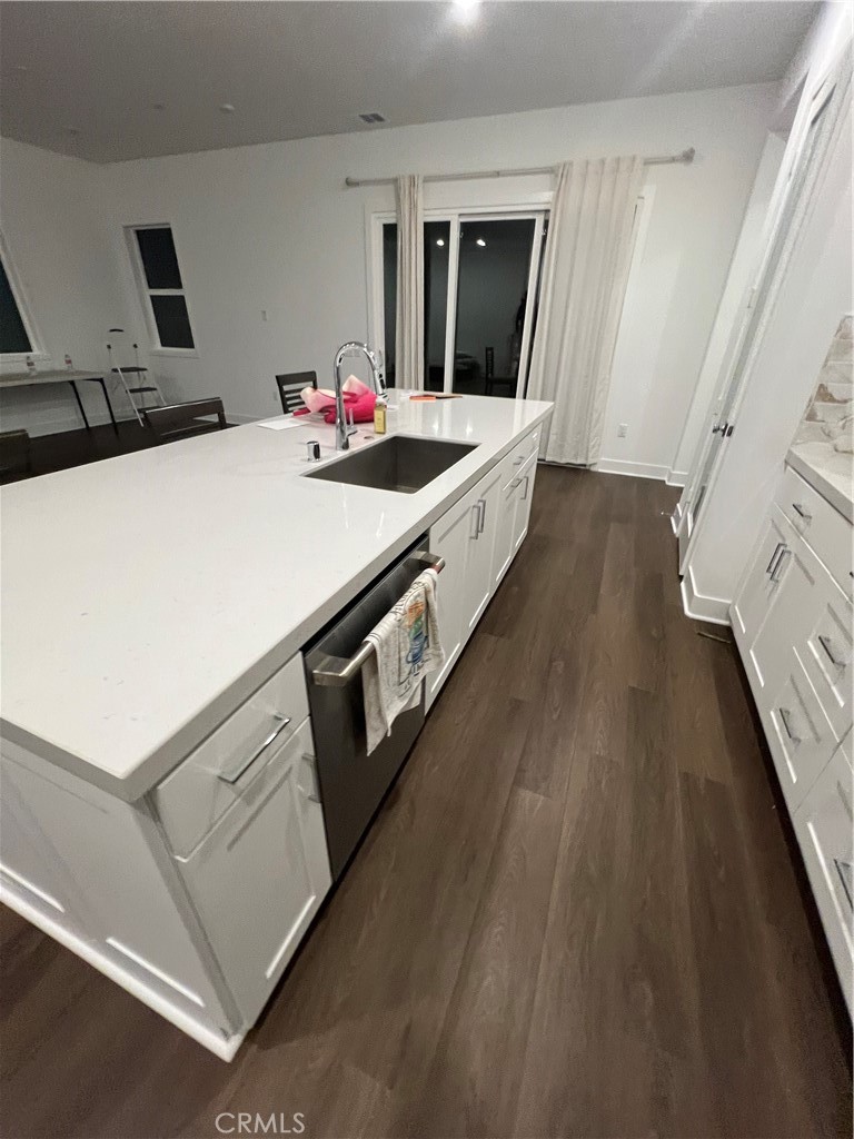 524 Gadwall Irvine, CA 92618 - Photo 6 of 24 a large white kitchen with sink stove and refrigerator