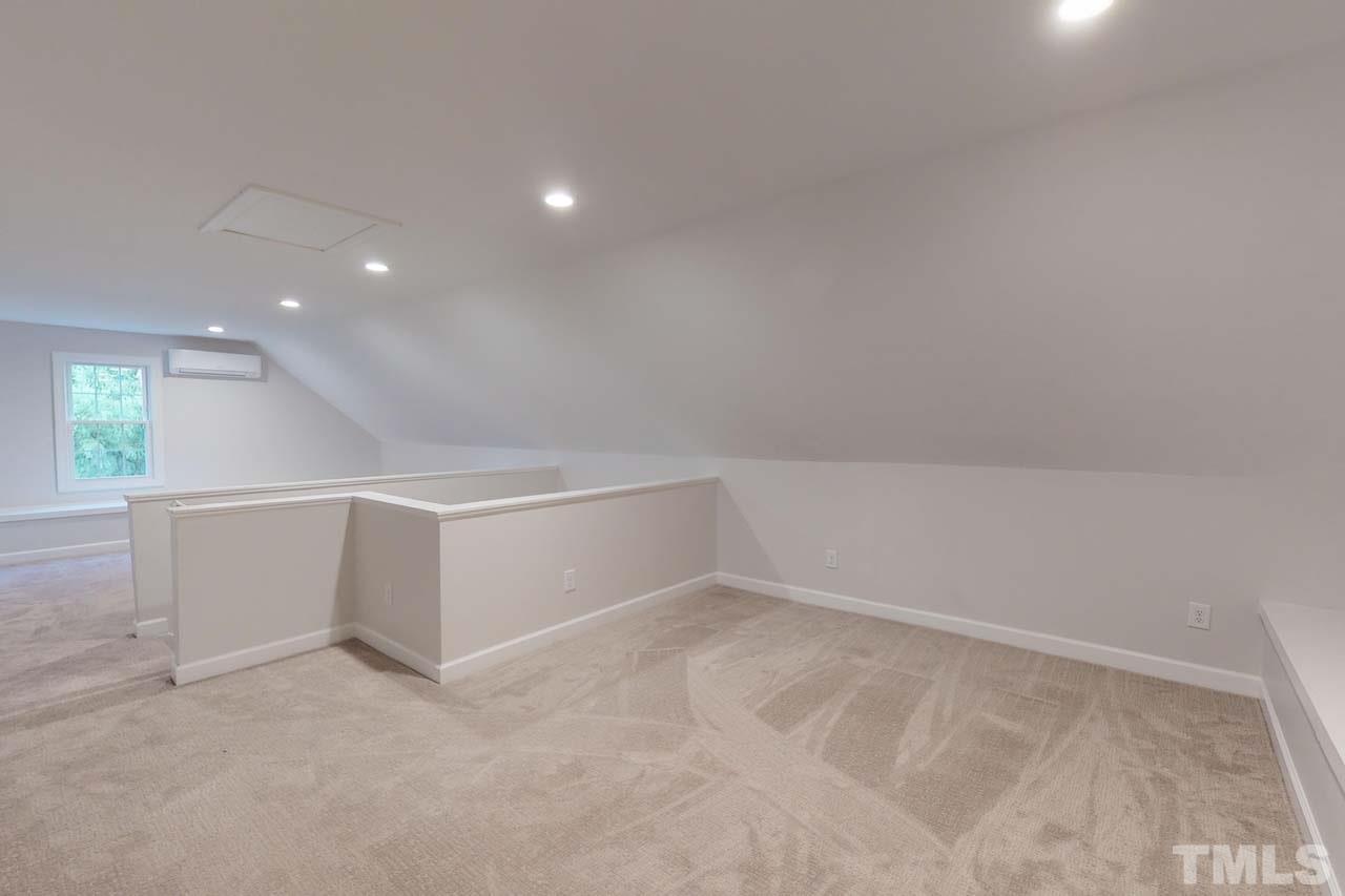 8601 Stanton Place Raleigh, NC 27615 - Photo 21 of 25 Head on up to the 3rd floor where you'll find peace from the bustle of the household. This space would function great as add'l business/office space, podcast studio, workout room or movie room. Professionally finished and permitted in the past year.