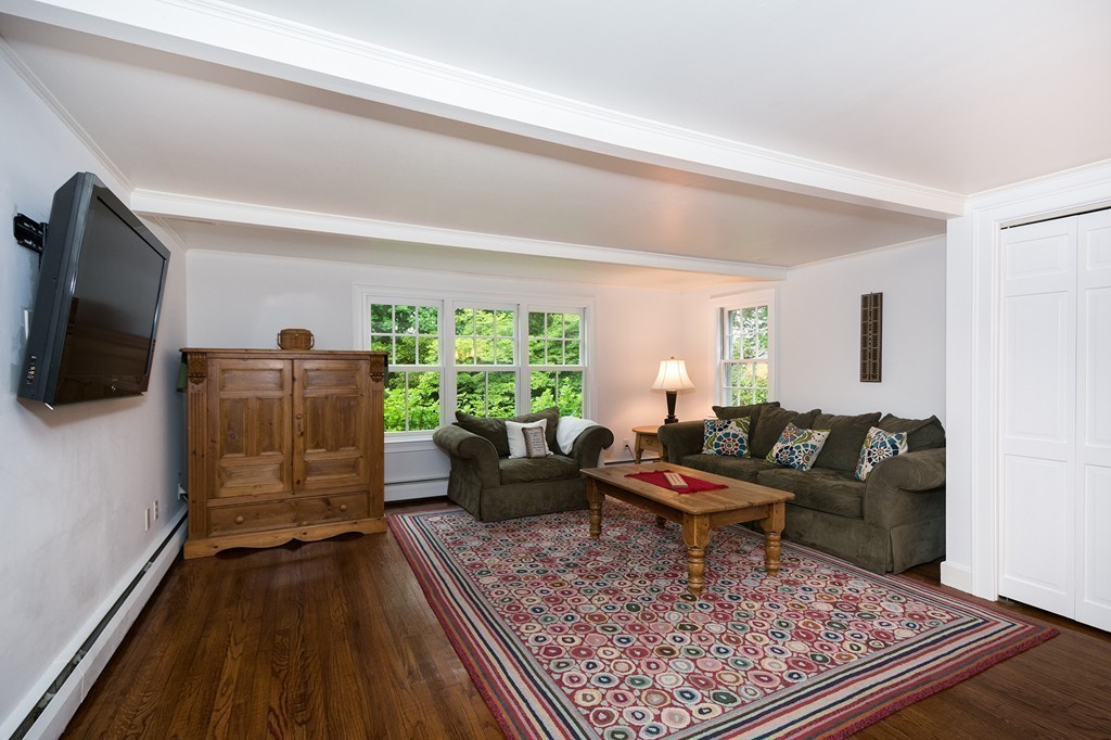 60 Powder Point Avenue Duxbury, MA 02332 - Photo 13 of 30 a living room with furniture and a rug