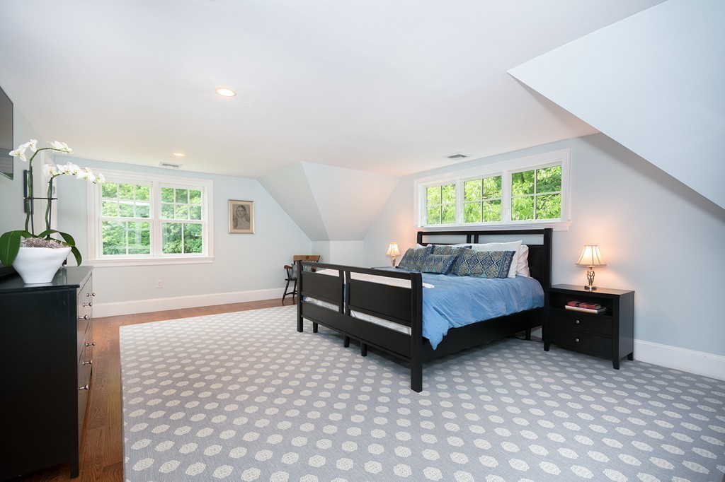 60 Powder Point Avenue Duxbury, MA 02332 - Photo 17 of 30 a bedroom with furniture and a window