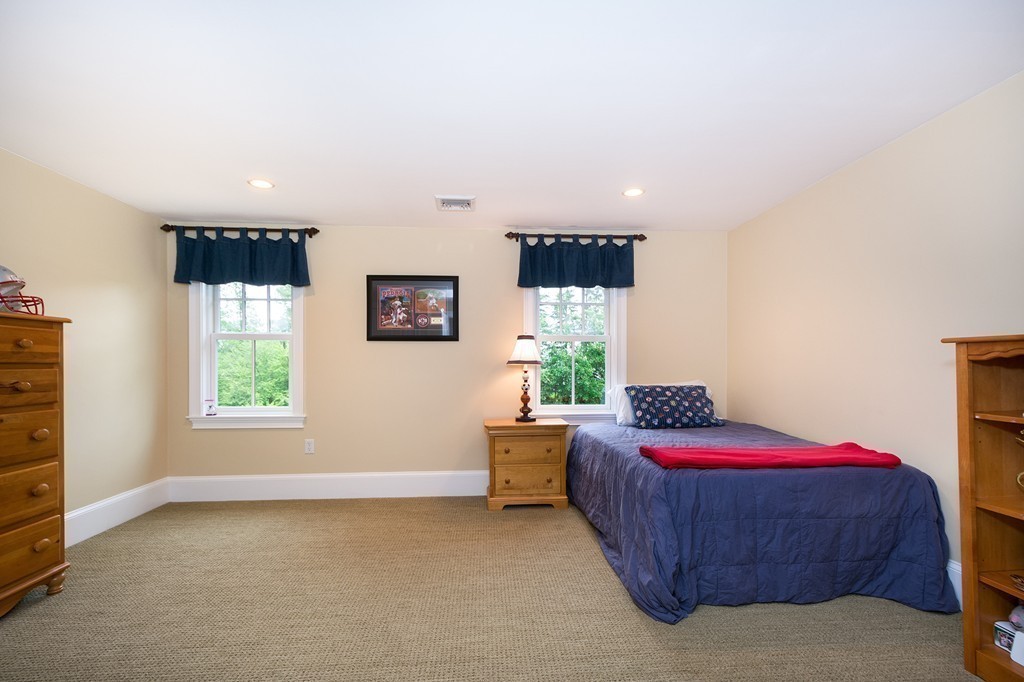 60 Powder Point Avenue Duxbury, MA 02332 - Photo 20 of 30 a bedroom with a bed and a window