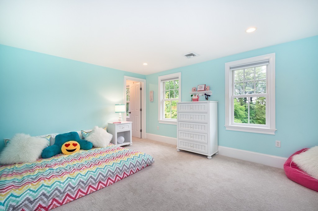 60 Powder Point Avenue Duxbury, MA 02332 - Photo 22 of 30 a bedroom with a bed and a window
