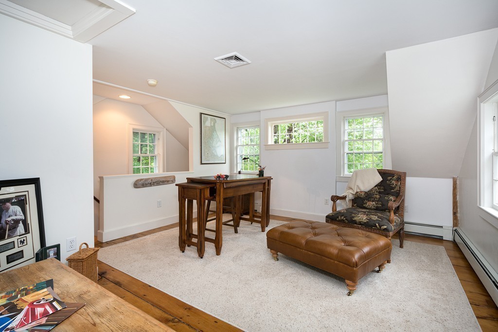 60 Powder Point Avenue Duxbury, MA 02332 - Photo 25 of 30 a living room with furniture and a large window