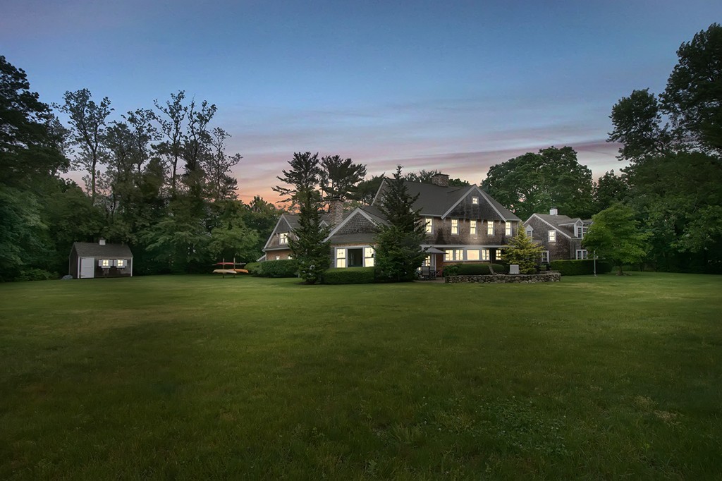 60 Powder Point Avenue Duxbury, MA 02332 - Photo 30 of 30 a view of a big yard with a house in the background