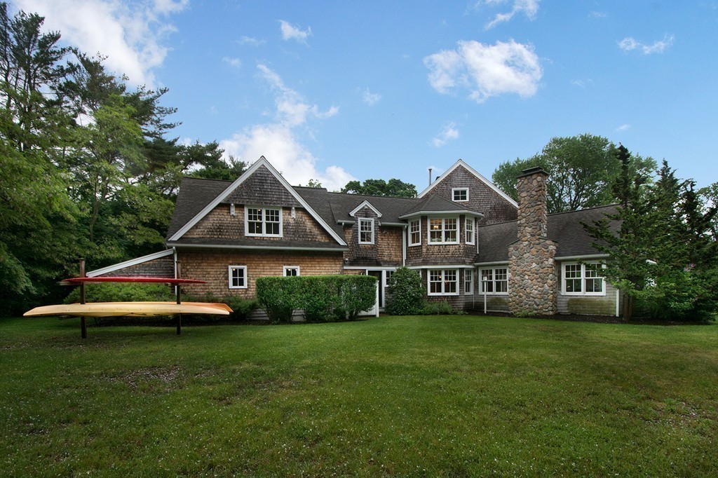 60 Powder Point Avenue Duxbury, MA 02332 - Photo 6 of 30 a front view of a house with a yard