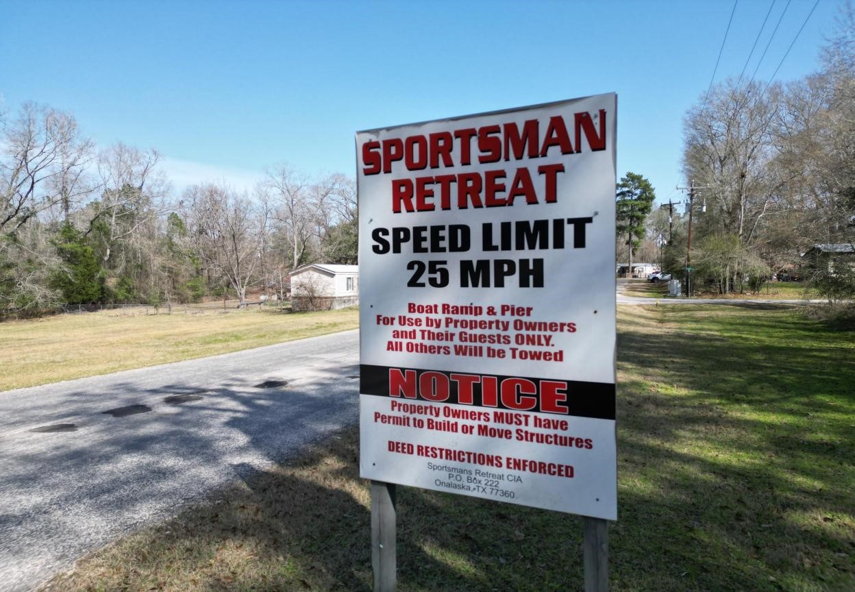0 Ellerbe Drive Onalaska, TX 77360 - Photo 2 of 13 a sign on the side of a building