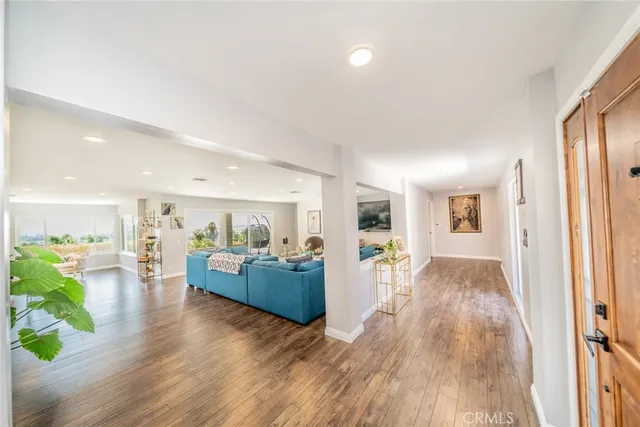 a living room with fireplace furniture and a chandelier