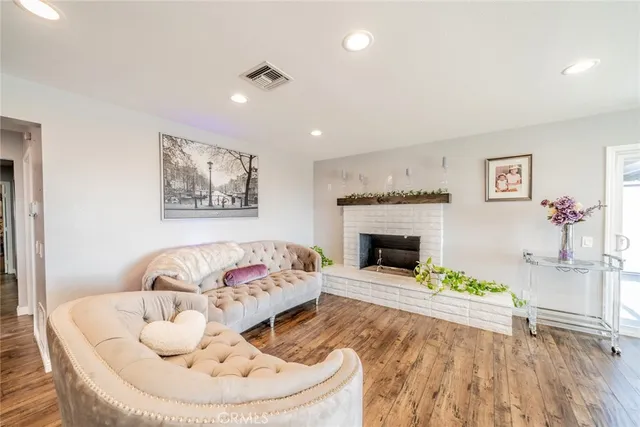 a kitchen with stainless steel appliances kitchen island granite countertop a sink stove and cabinets