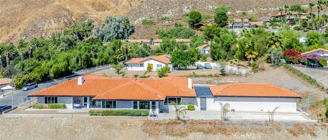 an outdoor space with furniture and barbeque oven