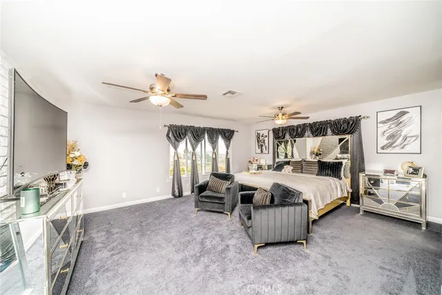 a view of walk in closet with clothes