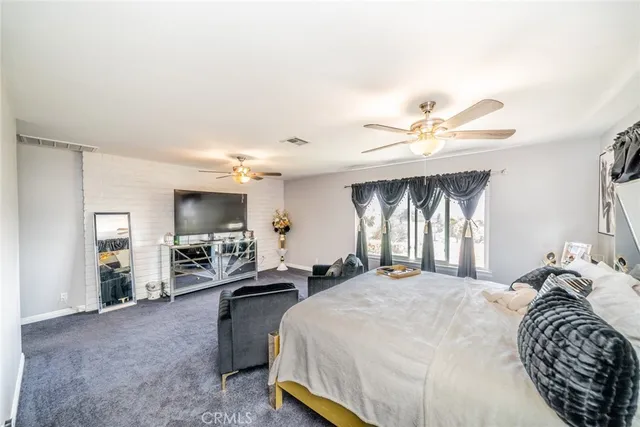 a view of walk in closet with clothes