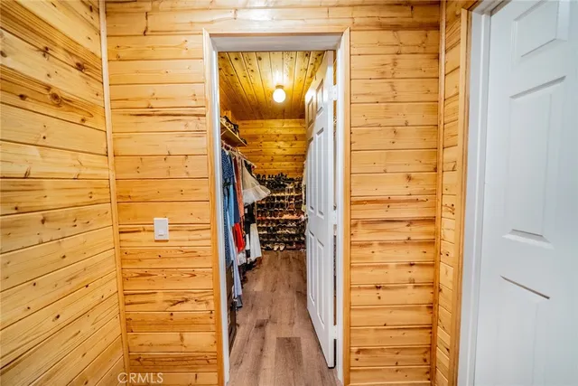 a bed room with a bed mirror and a window