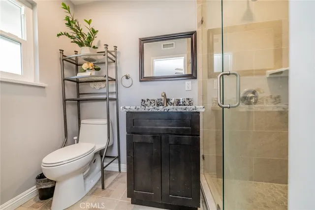 a bedroom with furniture and a dresser