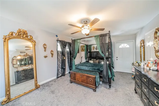 an aerial view of a house with a yard and lake view