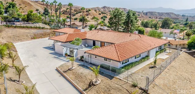 a living room with fireplace furniture and a wooden floor