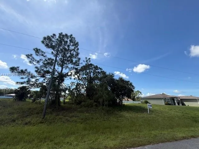 a view of a golf course with a lake