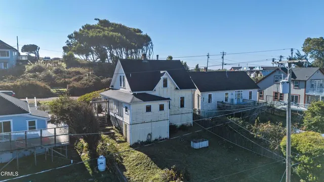 a aerial view of a house with large trees