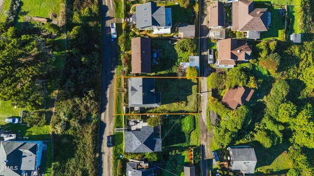 an aerial view of houses and roads