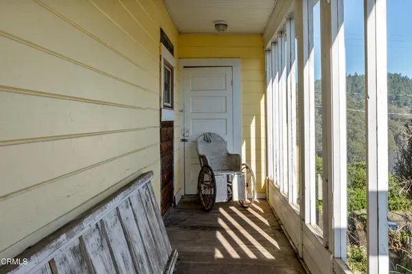 a view of a balcony and wooden floor