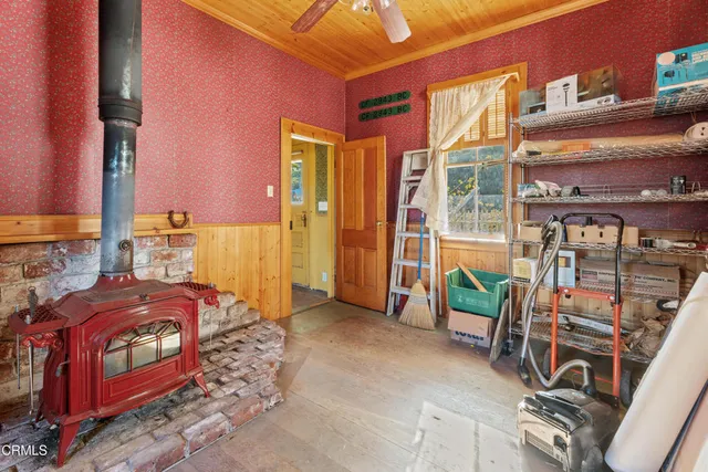 a bed room with a bed and a chair