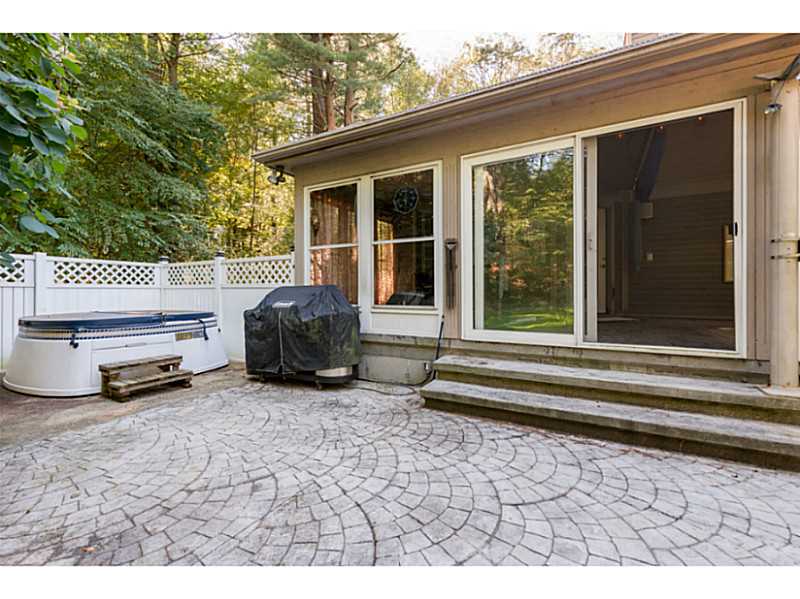 3383 Diamond Hill Road Cumberland, RI 02864 - Photo 25 of 25 Exterior Back. Enjoy the hot tub or expansive patio for entertaining.