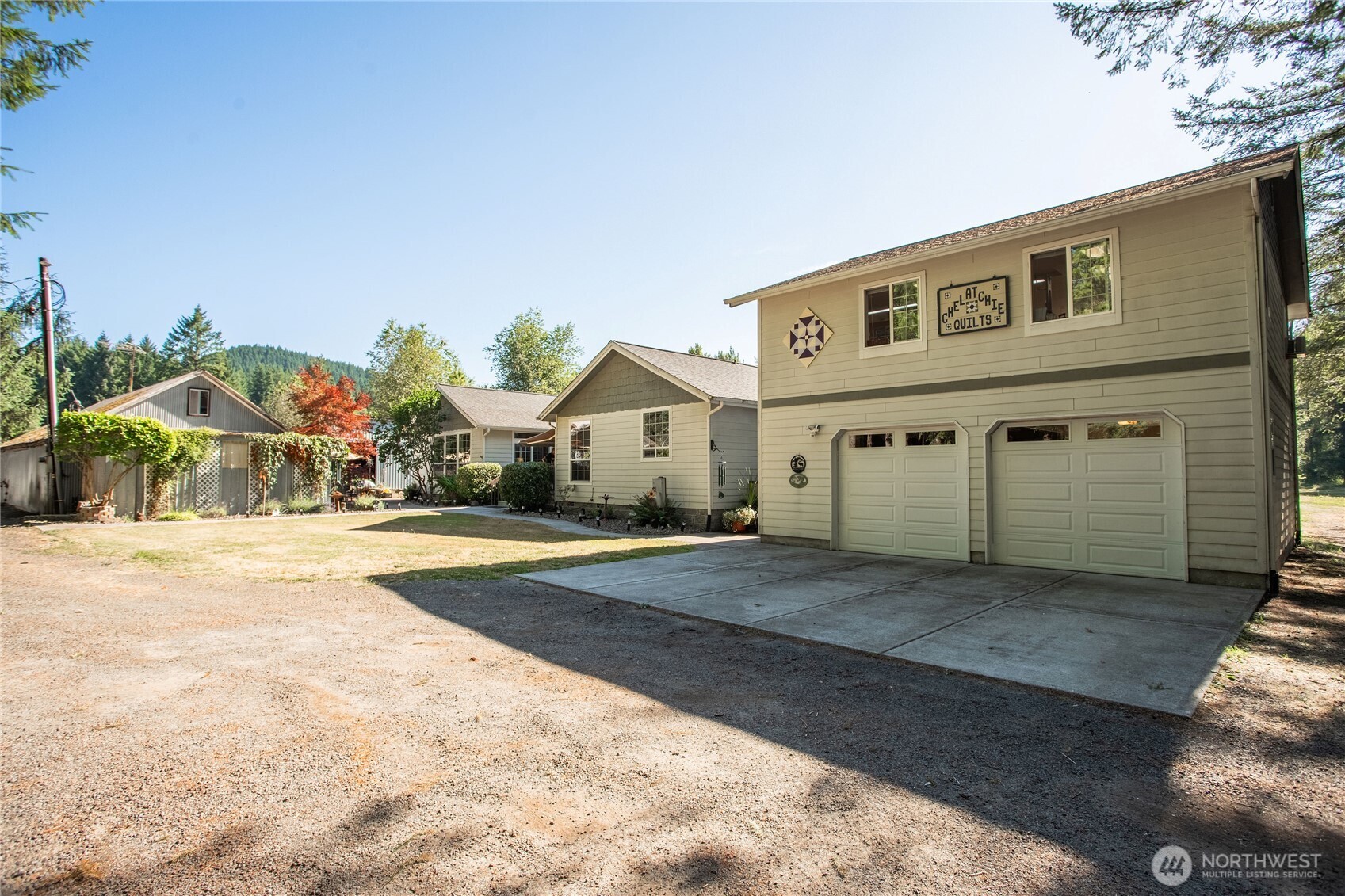 42107 Northeast Yale Bridge Road Amboy, WA 98601 - Photo 1 of 40 a front view of a house with a yard and garage