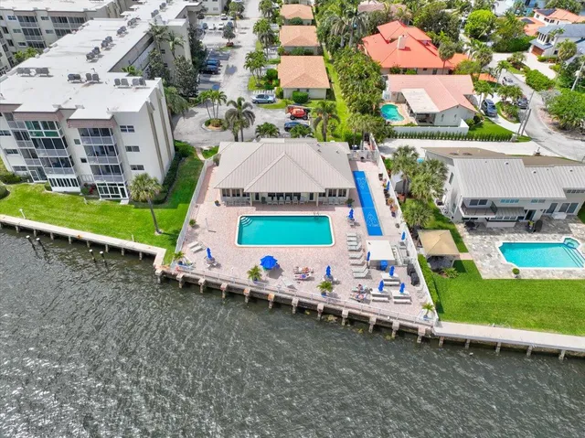 an aerial view of residential houses with outdoor space
