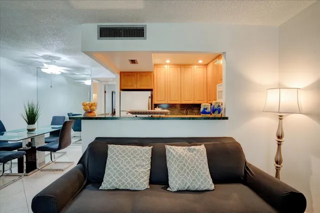 a livingroom with furniture and a flat screen tv