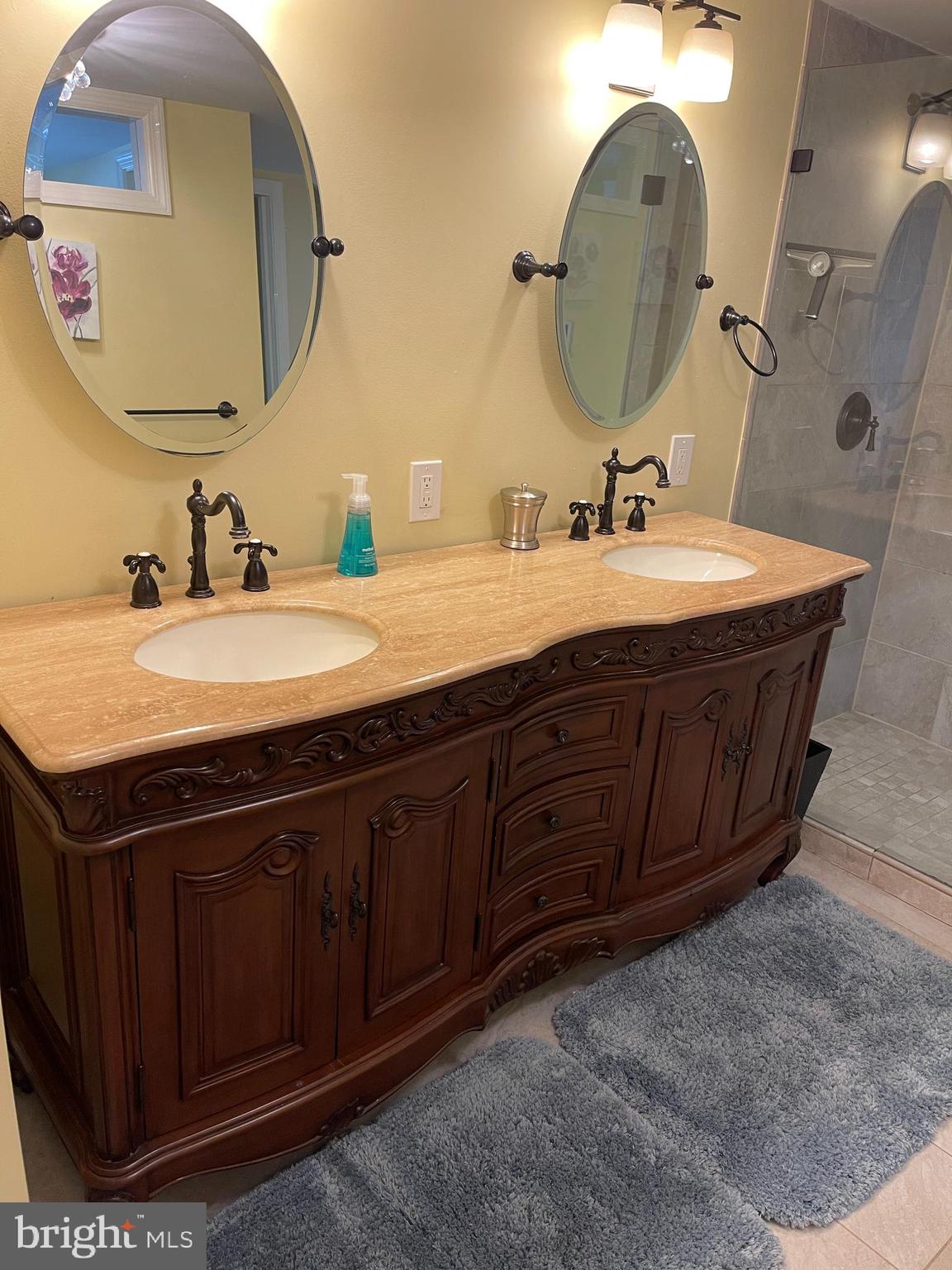 15 Chestnut Street Princeton, NJ 08542 - Photo 11 of 18 a bathroom with a granite countertop sink a mirror and vanity