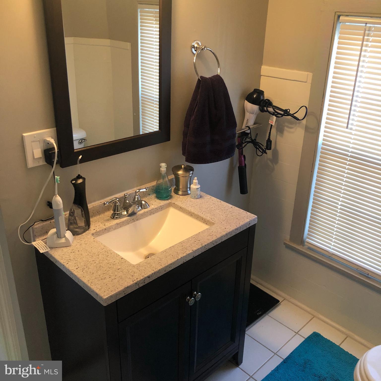 15 Chestnut Street Princeton, NJ 08542 - Photo 14 of 18 a bathroom with a sink and a mirror