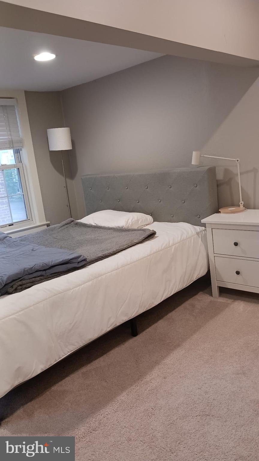 15 Chestnut Street Princeton, NJ 08542 - Photo 16 of 18 a bedroom with a bed and a mirror