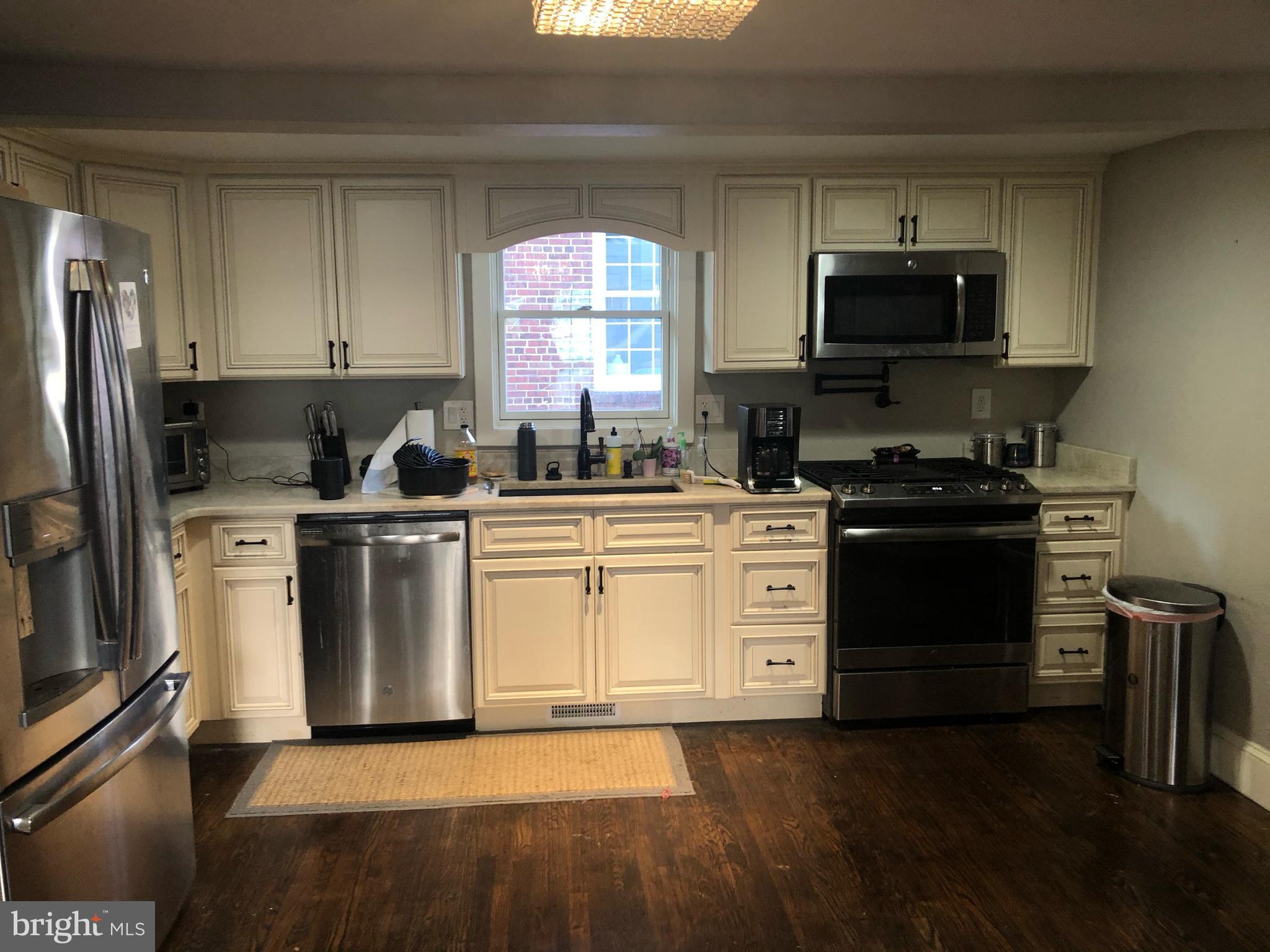 15 Chestnut Street Princeton, NJ 08542 - Photo 6 of 18 a kitchen with a sink a stove and refrigerator