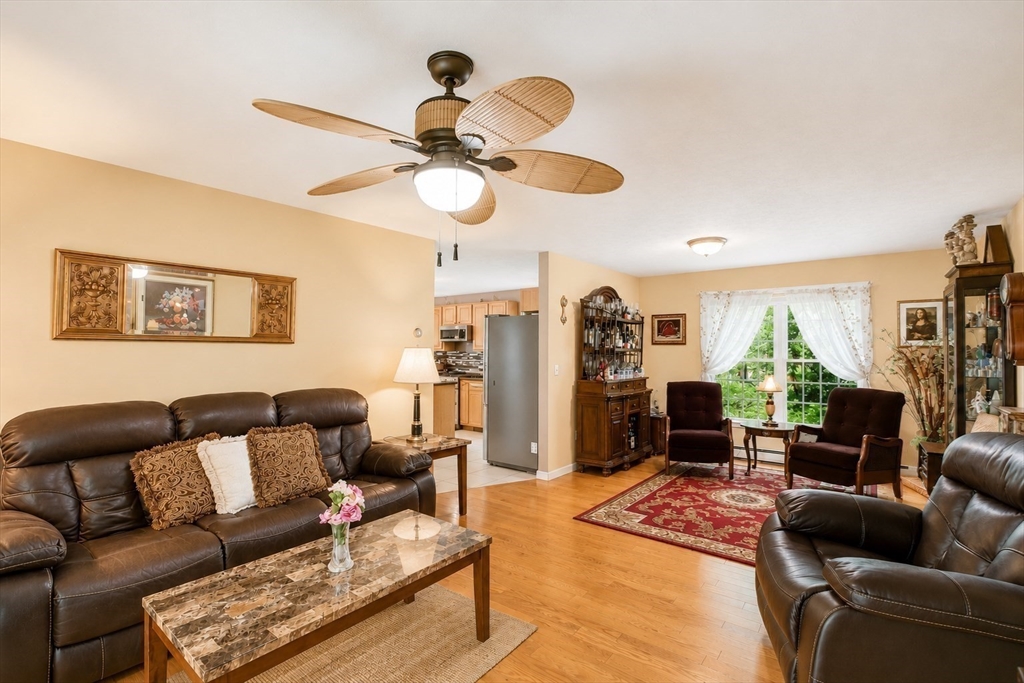 6 Loon Road Winchendon, MA 01475 - Photo 11 of 36 a living room with furniture ceiling fan and a rug