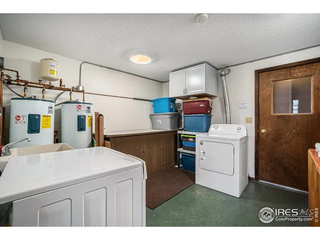 a view of a backyard with plants and a patio