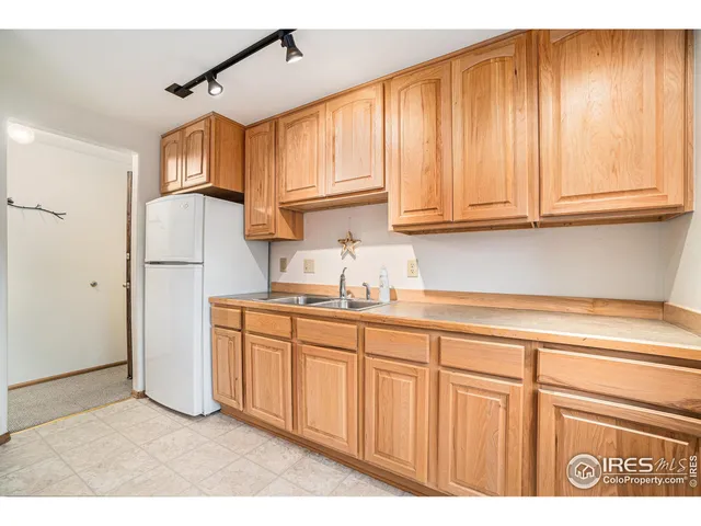 a bedroom with furniture and a large window