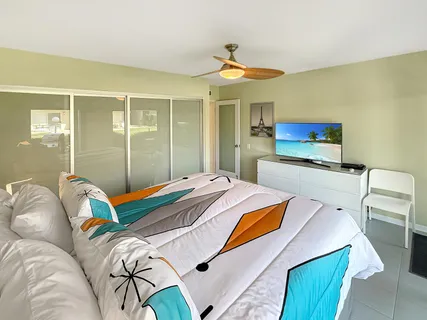 a bedroom with a bed and with table
